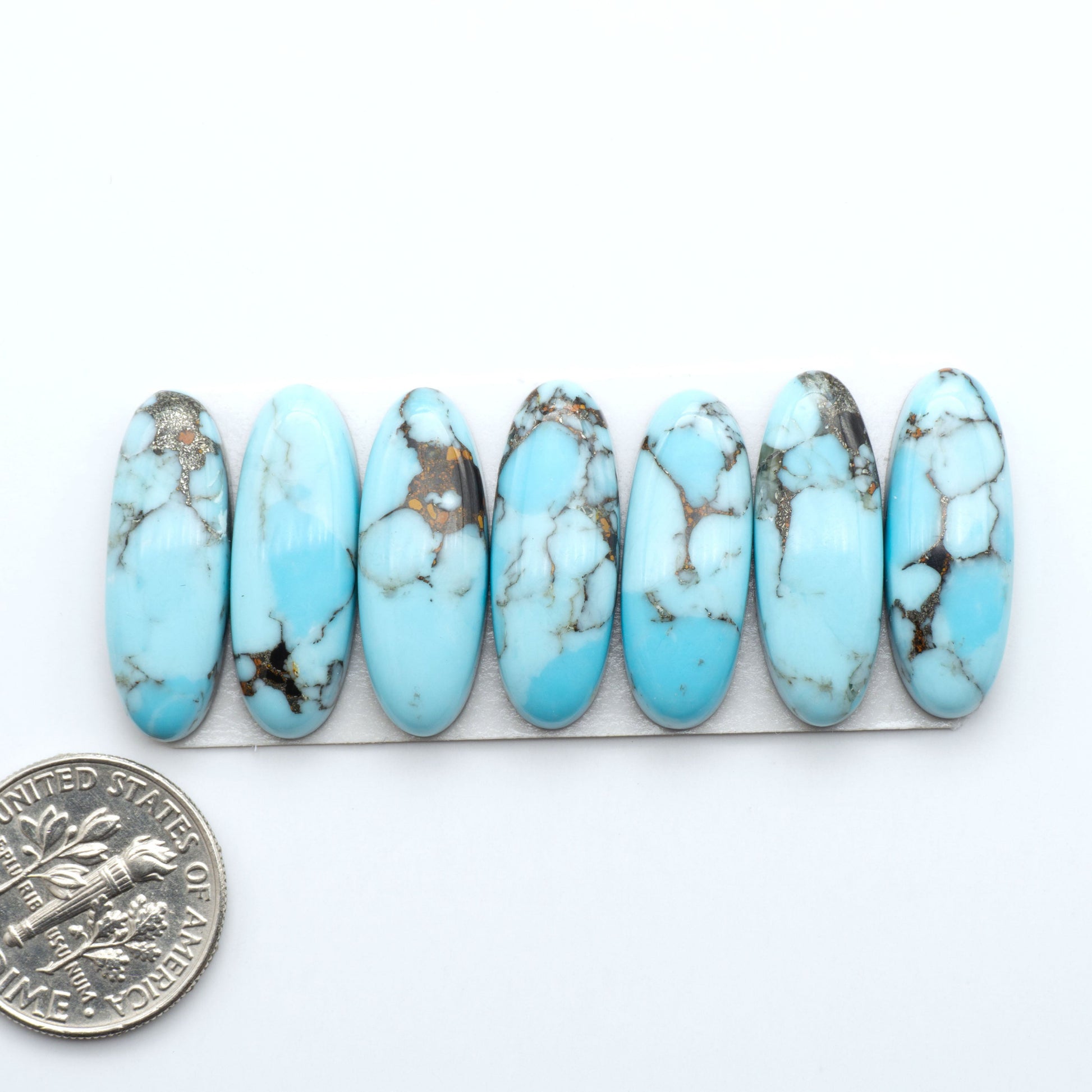 Enhance your jewelry designs with Pressed Turquoise Nugget Cabochons. Crafted from composite materials they add a captivating touch to your creations.