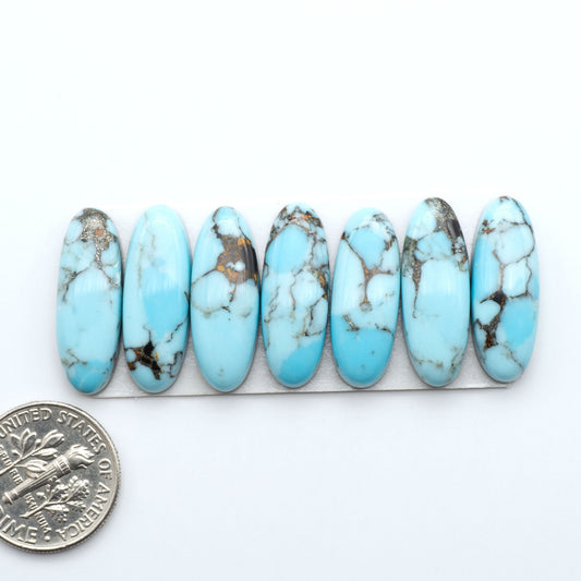 Enhance your jewelry designs with Pressed Turquoise Nugget Cabochons. Crafted from composite materials they add a captivating touch to your creations.