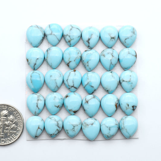 Enhance your jewelry designs with Pressed Turquoise Nugget Cabochons. Crafted from composite materials they add a captivating touch to your creations.