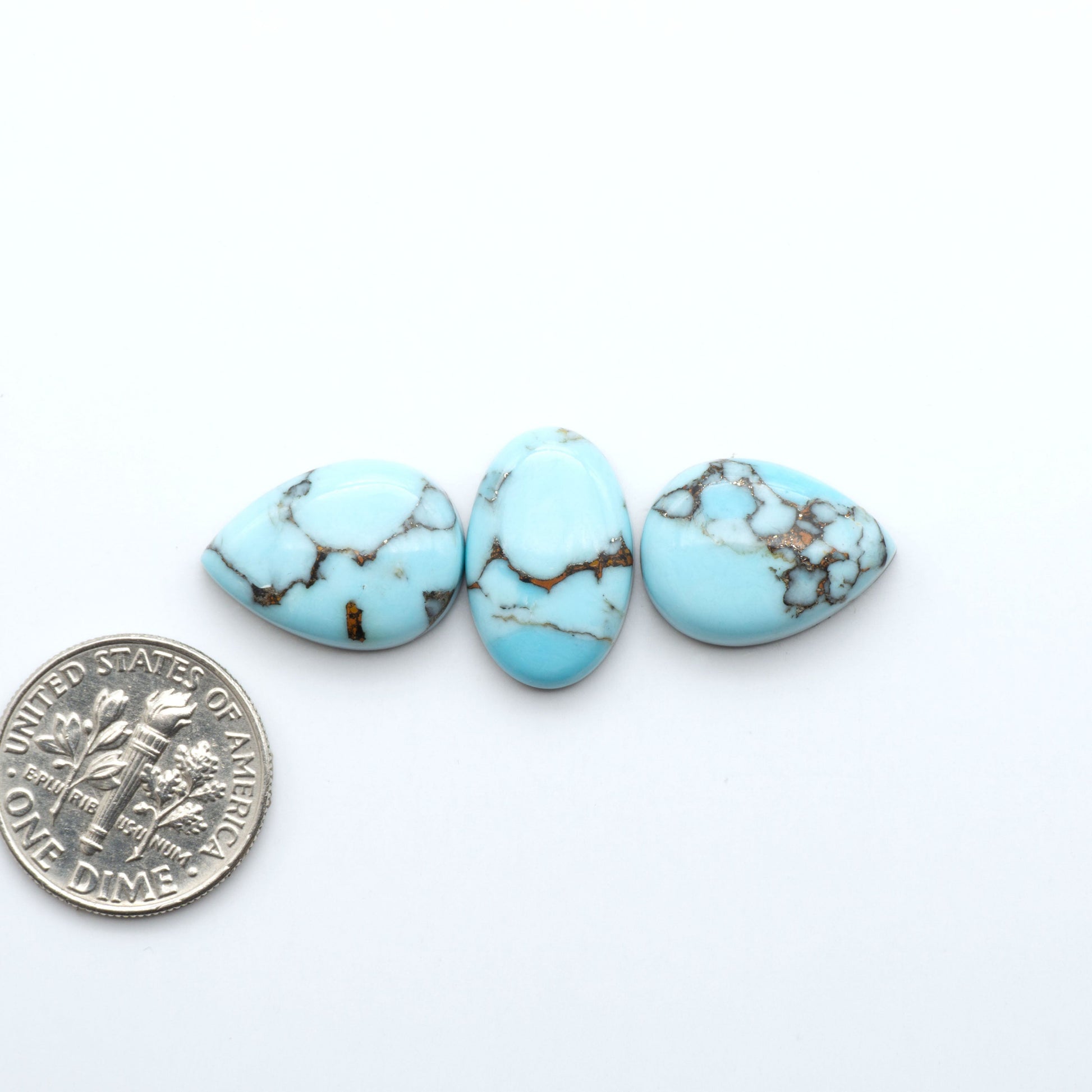 Enhance your jewelry designs with Pressed Turquoise Nugget Cabochons. Crafted from composite materials they add a captivating touch to your creations.