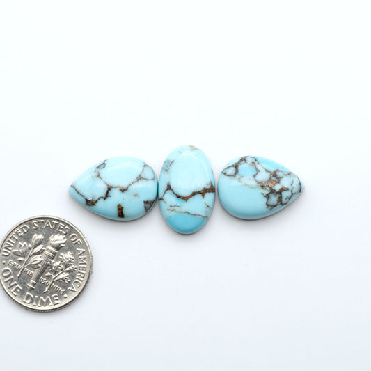 Enhance your jewelry designs with Pressed Turquoise Nugget Cabochons. Crafted from composite materials they add a captivating touch to your creations.