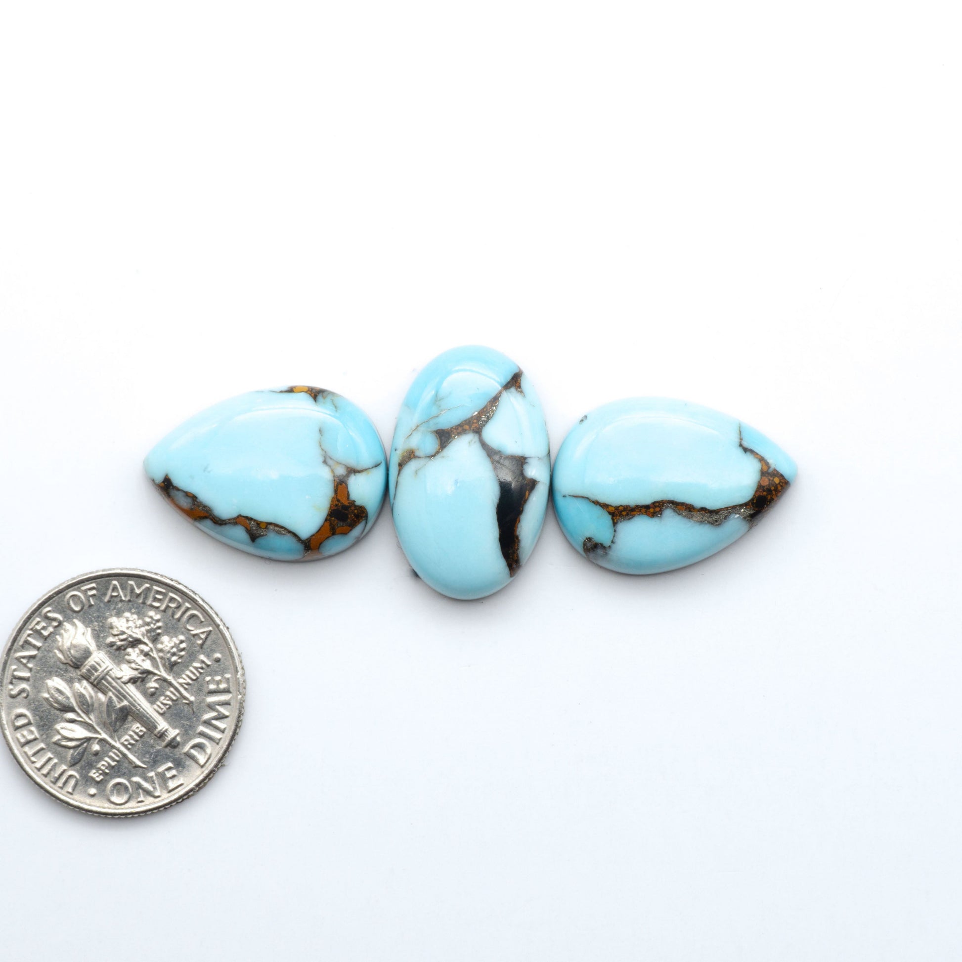 Enhance your jewelry designs with Pressed Turquoise Nugget Cabochons. Crafted from composite materials they add a captivating touch to your creations.
