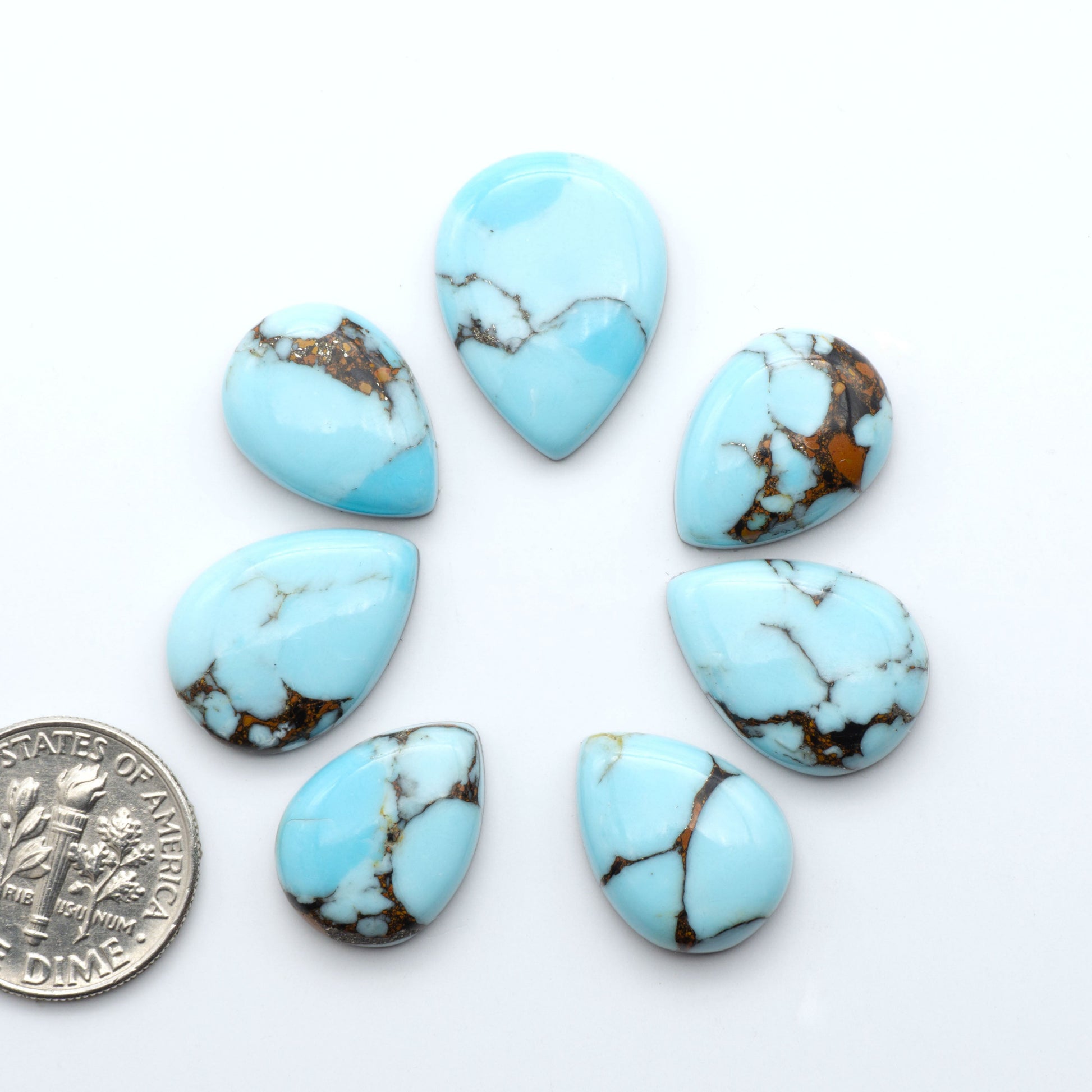 Enhance your jewelry designs with Pressed Turquoise Nugget Cabochons. Crafted from composite materials they add a captivating touch to your creations.