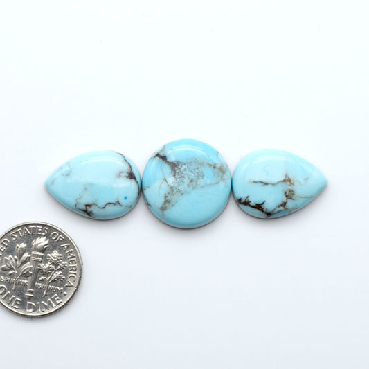 Enhance your jewelry designs with Pressed Turquoise Nugget Cabochons. Crafted from composite materials they add a captivating touch to your creations.