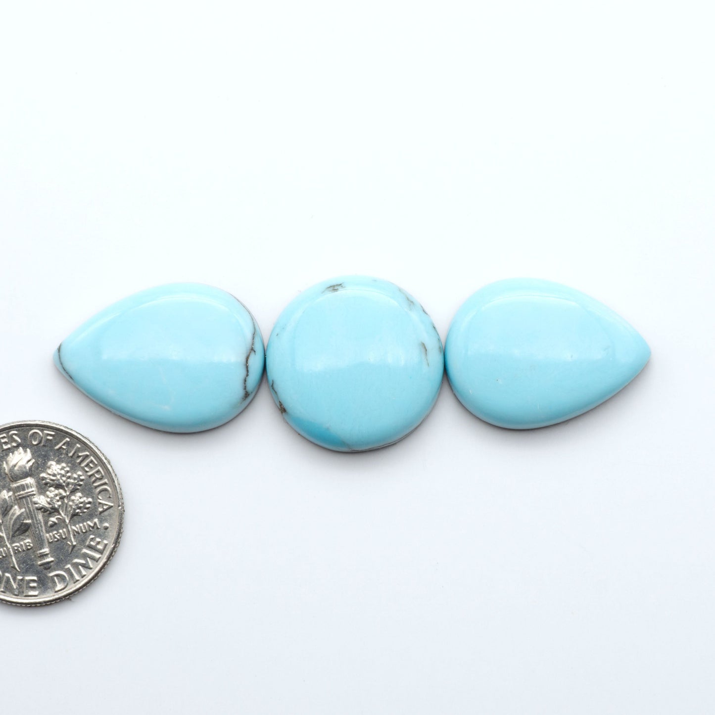 Enhance your jewelry designs with Pressed Turquoise Nugget Cabochons. Crafted from composite materials they add a captivating touch to your creations.