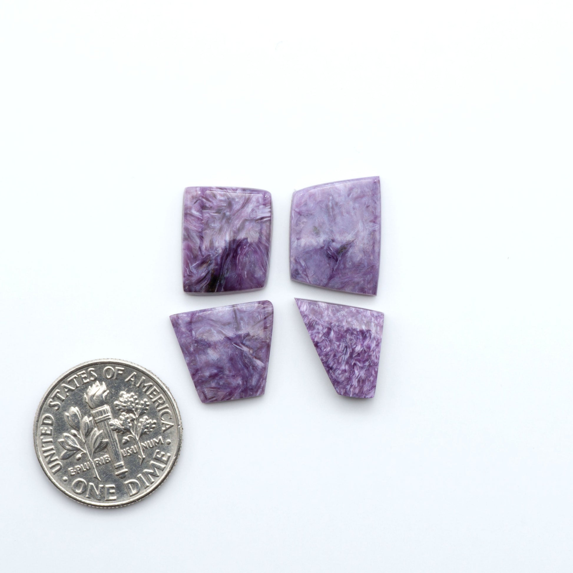 natural Charoite cabochons with vivid violet swirls, perfect for jewelry makers and silversmiths creating rings, pendants, and custom designs.