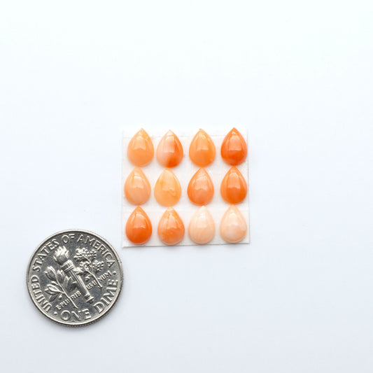 Discover natural pink Coral cabochons with soft salmon hues and smooth polish, ideal for creating timeless handcrafted rings, pendants, and custom designs.