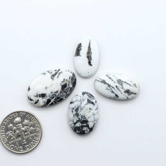 Natural White Buffalo Stone Cabochons are semi-precious gemstones cut into shapes ideal for jewelry-making, making them an excellent choice for artisans.