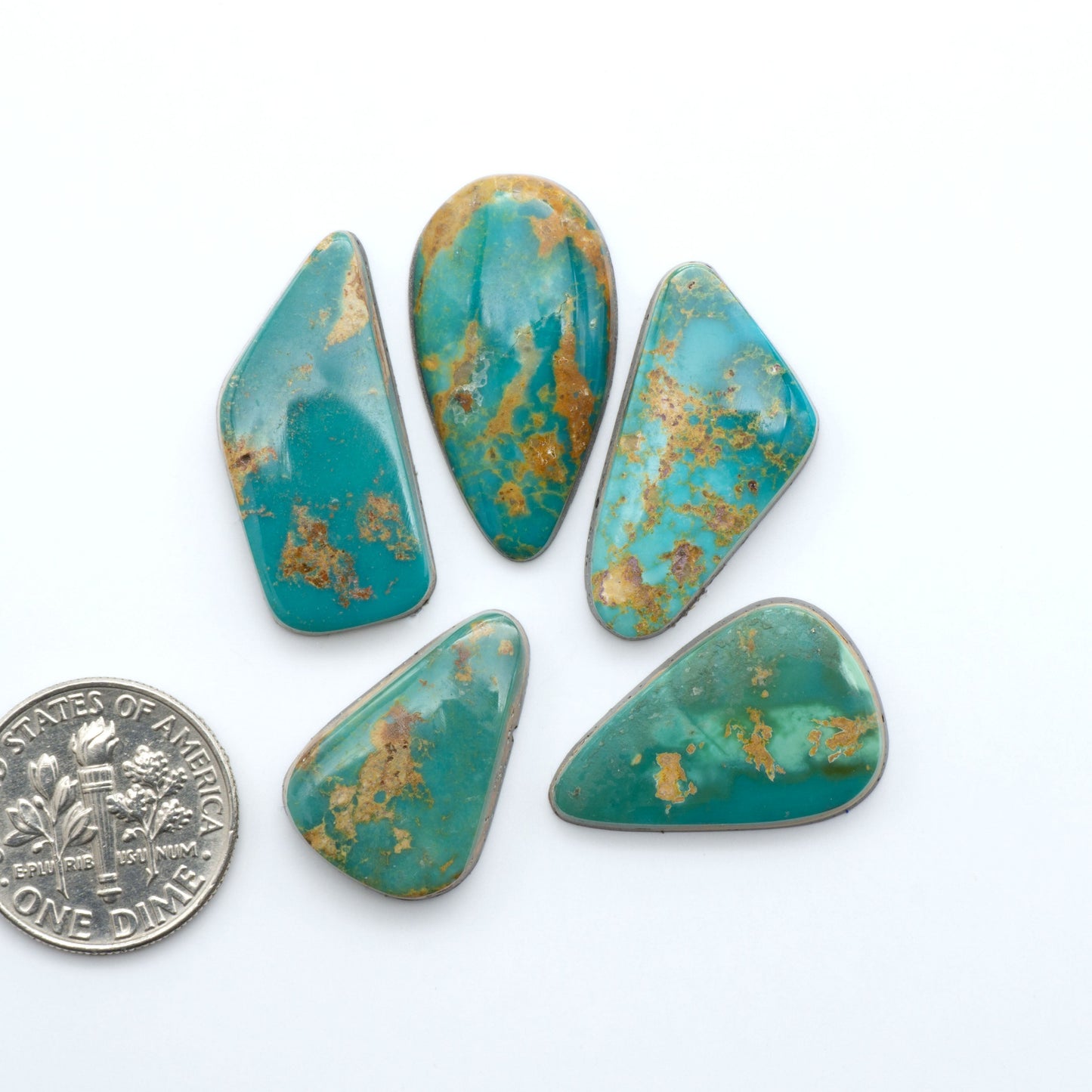 Royston Turquoise cabochons are famous for their distinctive matrix and unique green and blue hues, making them a favored option among jewelry designers.