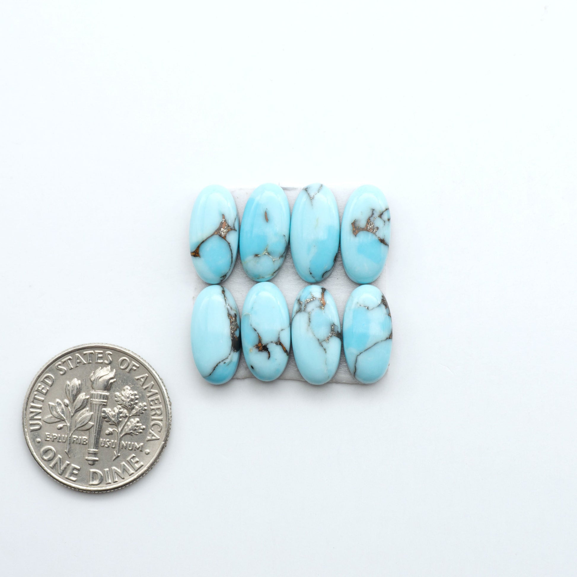 Enhance your jewelry designs with Pressed Turquoise Nugget Cabochons. Crafted from composite materials they add a captivating touch to your creations.

