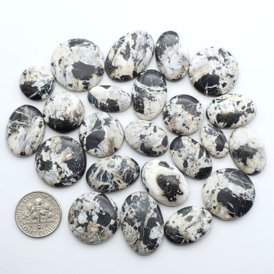 Natural White Buffalo Stone Cabochons are semi-precious gemstones cut into shapes ideal for jewelry-making, making them an excellent choice for artisans.