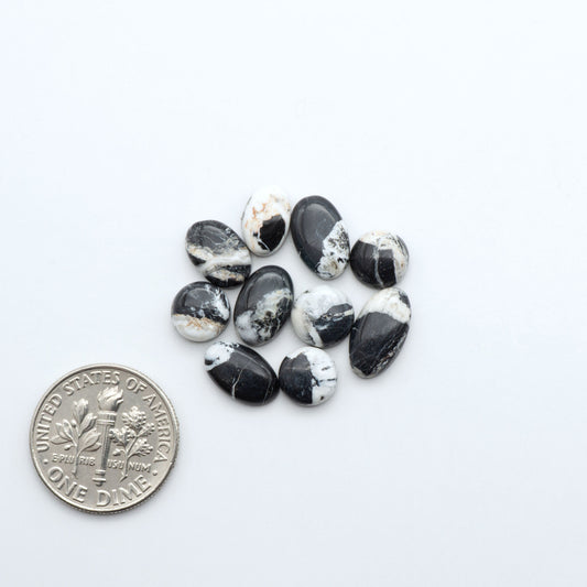 Natural White Buffalo Stone Cabochons are semi-precious gemstones cut into shapes ideal for jewelry-making, making them an excellent choice for artisans.