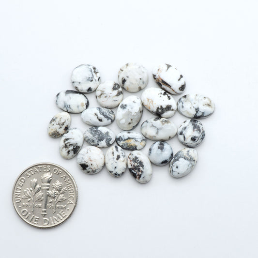 Natural White Buffalo Stone Cabochons are semi-precious gemstones cut into shapes ideal for jewelry-making, making them an excellent choice for artisans.