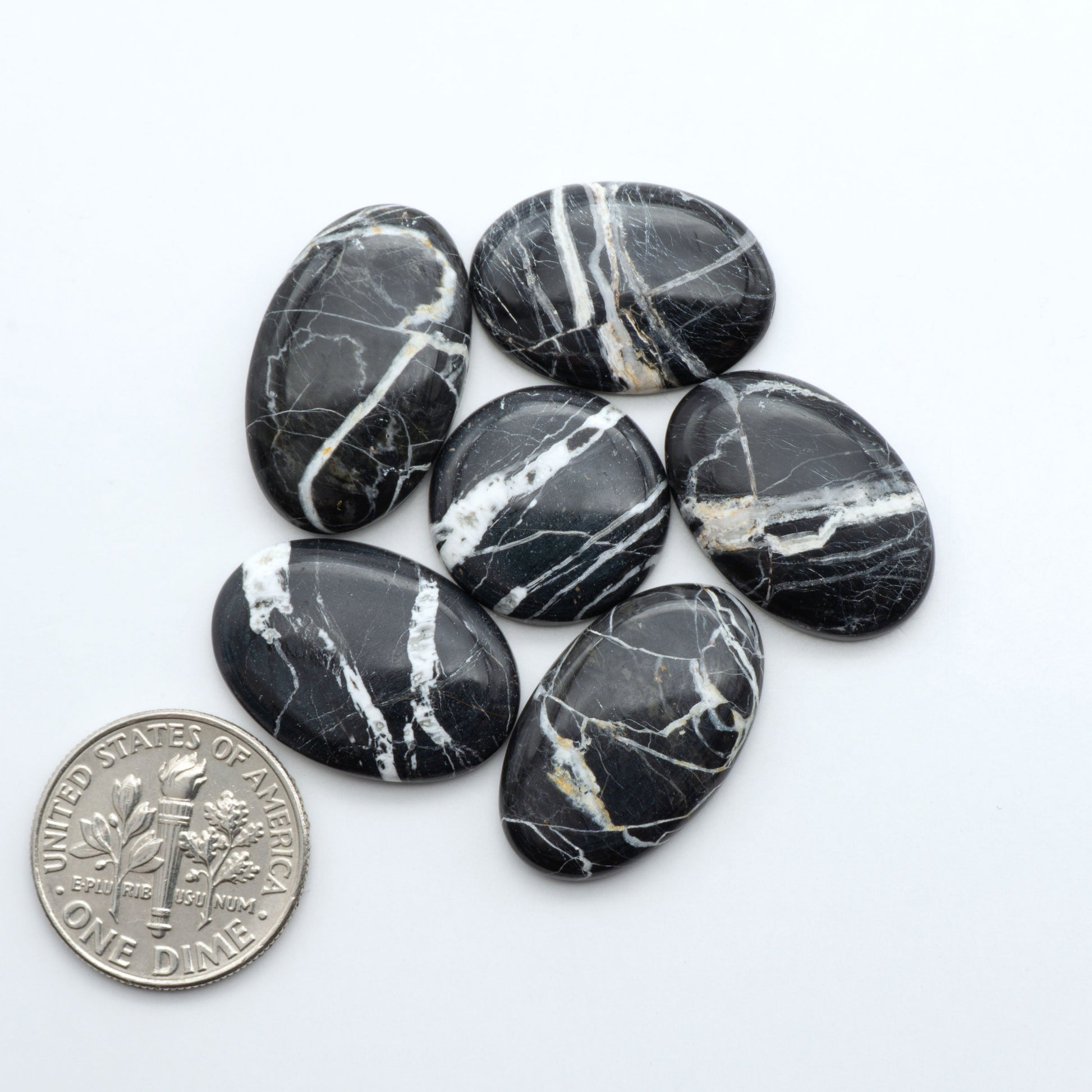 Natural White Buffalo Stone Cabochons are semi-precious gemstones cut into shapes ideal for jewelry-making, making them an excellent choice for artisans.