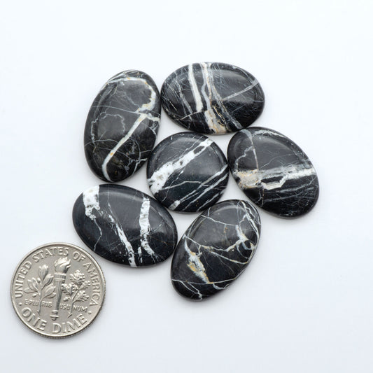 Natural White Buffalo Stone Cabochons are semi-precious gemstones cut into shapes ideal for jewelry-making, making them an excellent choice for artisans.