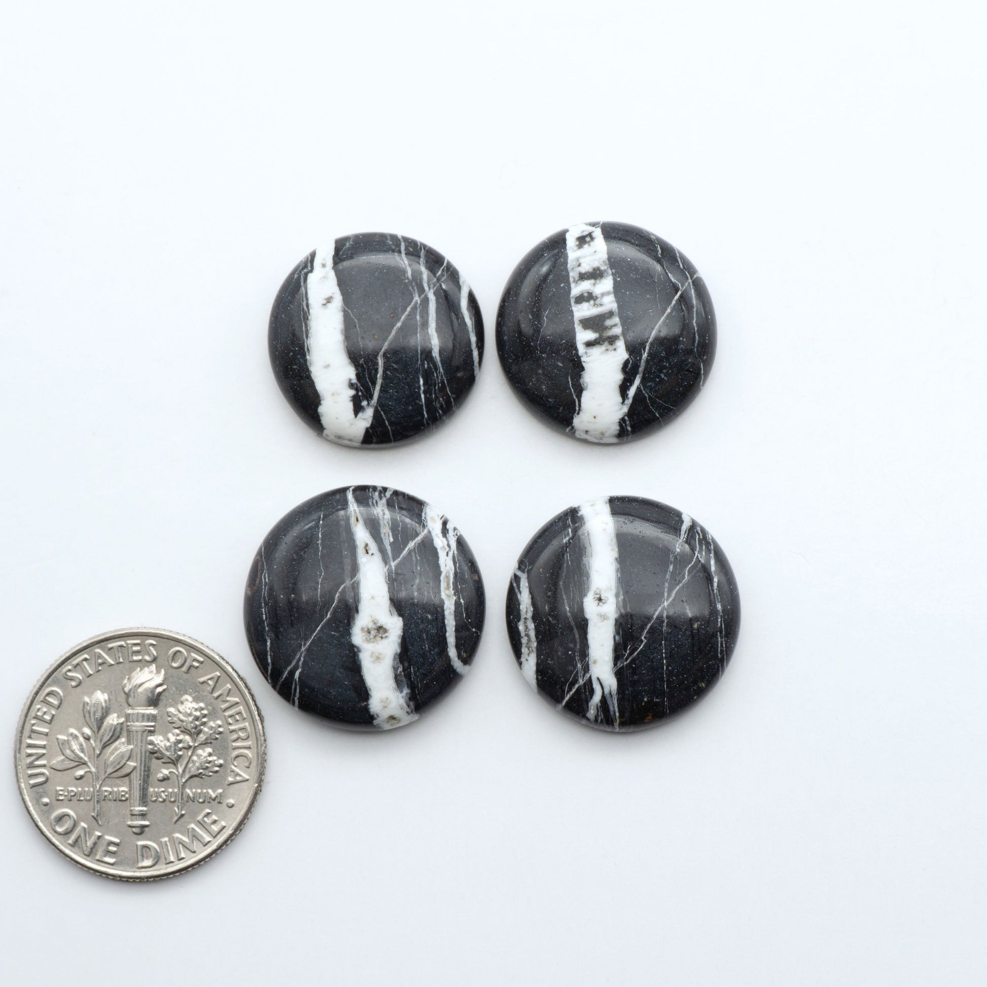 Natural White Buffalo Stone Cabochons are semi-precious gemstones cut into shapes ideal for jewelry-making, making them an excellent choice for artisans.