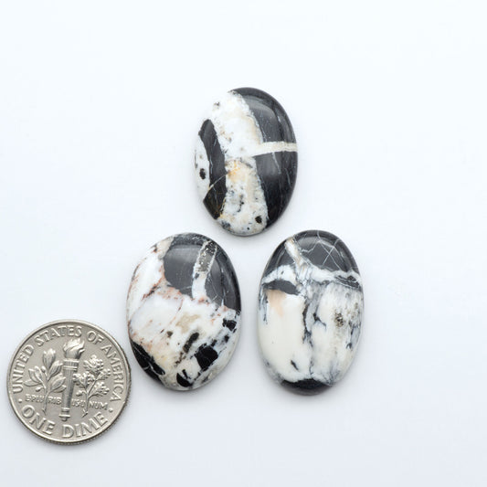Natural White Buffalo Stone Cabochons are semi-precious gemstones cut into shapes ideal for jewelry-making, making them an excellent choice for artisans.