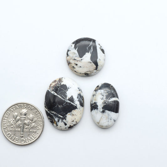 Natural White Buffalo Stone Cabochons are semi-precious gemstones cut into shapes ideal for jewelry-making, making them an excellent choice for artisans.