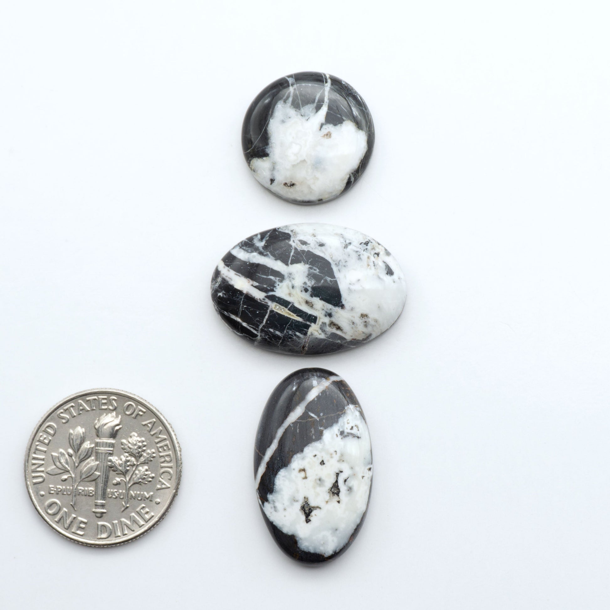 Natural White Buffalo Stone Cabochons are semi-precious gemstones cut into shapes ideal for jewelry-making, making them an excellent choice for artisans.
