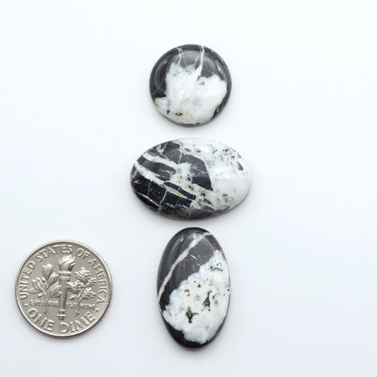 Natural White Buffalo Stone Cabochons are semi-precious gemstones cut into shapes ideal for jewelry-making, making them an excellent choice for artisans.