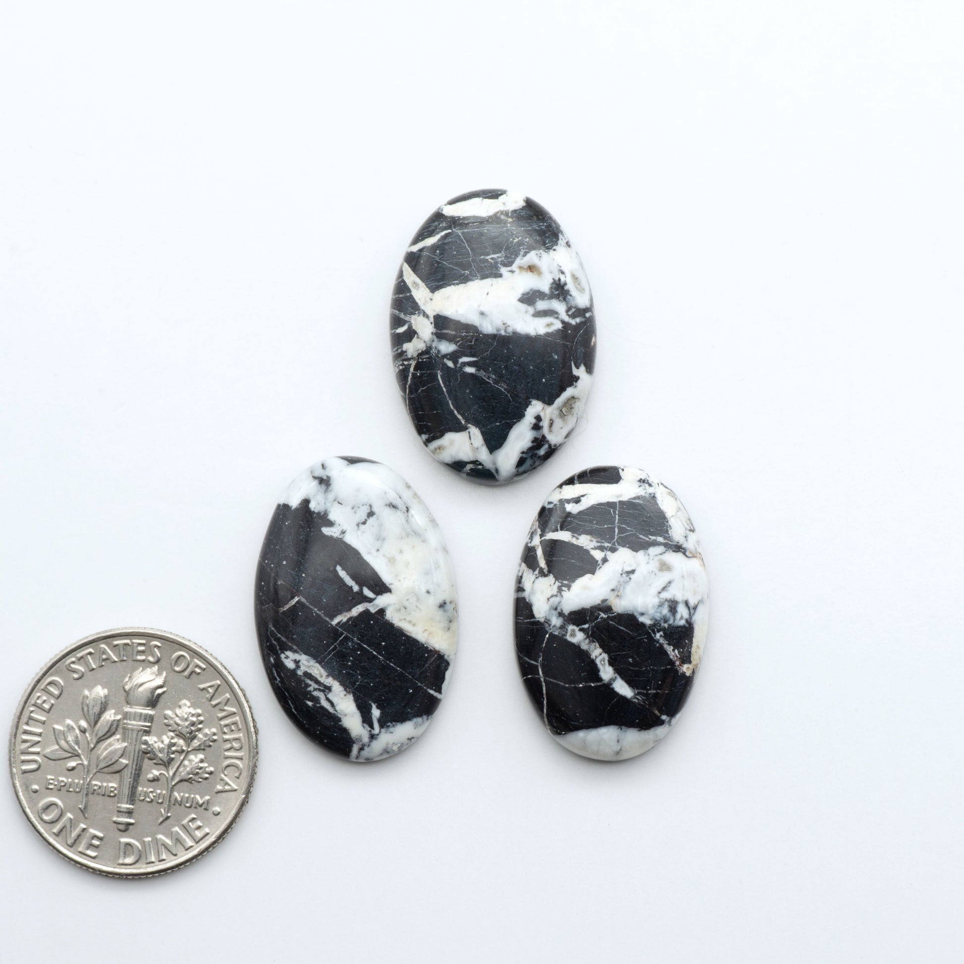 Natural White Buffalo Stone Cabochons are semi-precious gemstones cut into shapes ideal for jewelry-making, making them an excellent choice for artisans.