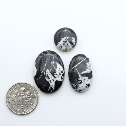 Natural White Buffalo Stone Cabochons are semi-precious gemstones cut into shapes ideal for jewelry-making, making them an excellent choice for artisans.