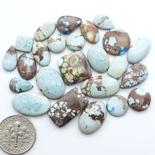 Discover the beauty of Natural Golden Hills Turquoise—prized for its icy blue tones, golden matrix, and exceptional quality. Ideal for artisan jewelry designs.