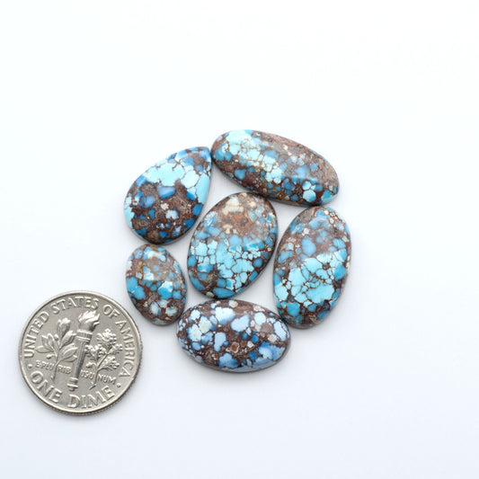 Discover the beauty of Natural Golden Hills Turquoise—prized for its icy blue tones, golden matrix, and exceptional quality. Ideal for artisan jewelry designs.