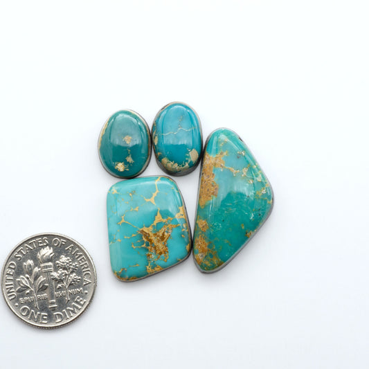 Royston Turquoise cabochons are famous for their distinctive matrix and unique green and blue hues, making them a favored option among jewelry designers.