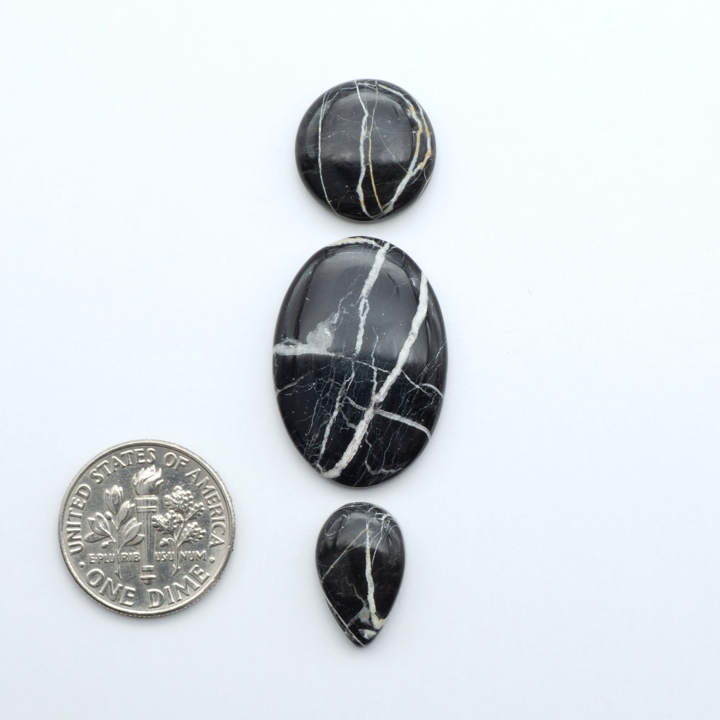 Natural White Buffalo Stone Cabochons are semi-precious gemstones cut into shapes ideal for jewelry-making, making them an excellent choice for artisans.

