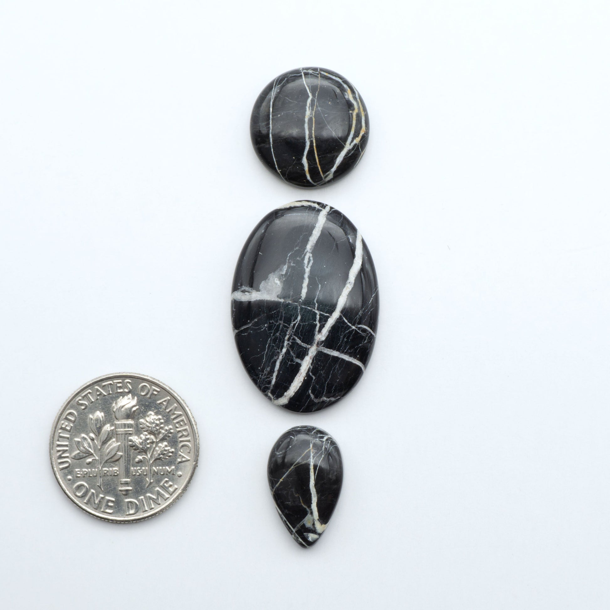 Natural White Buffalo Stone Cabochons are semi-precious gemstones cut into shapes ideal for jewelry-making, making them an excellent choice for artisans.

