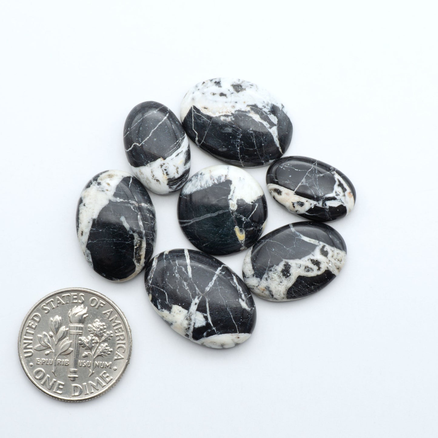 Natural White Buffalo Stone Cabochons are semi-precious gemstones cut into shapes ideal for jewelry-making, making them an excellent choice for artisans.


