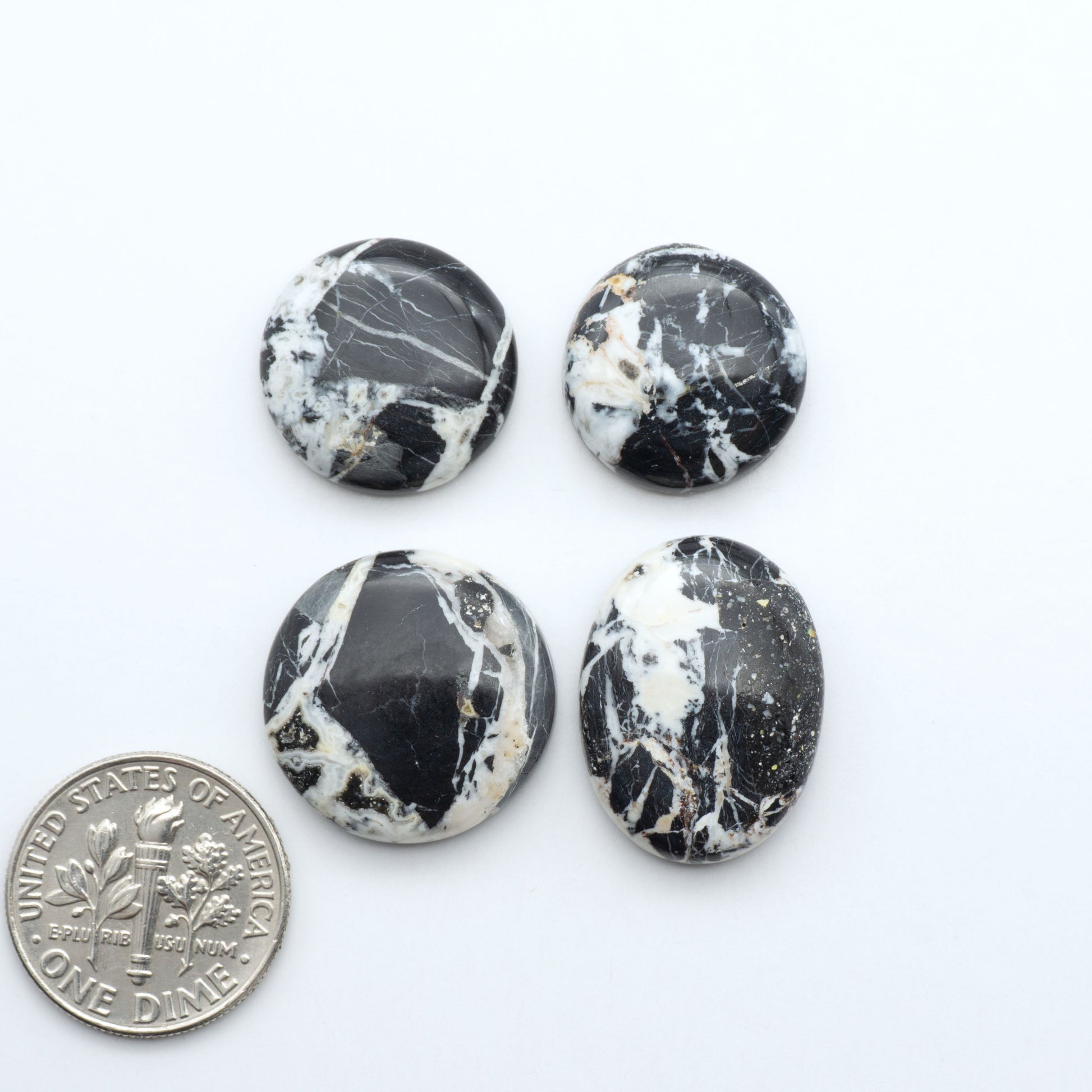 Natural White Buffalo Stone Cabochons are semi-precious gemstones cut into shapes ideal for jewelry-making, making them an excellent choice for artisans.

