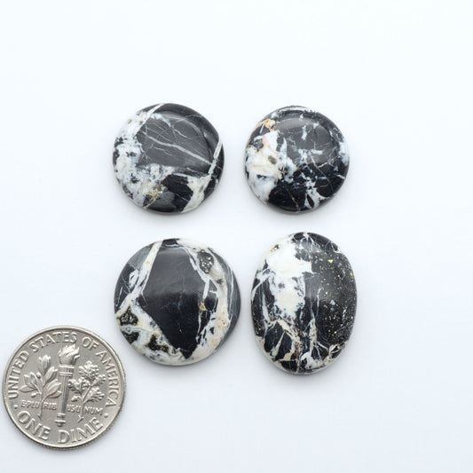 Natural White Buffalo Stone Cabochons are semi-precious gemstones cut into shapes ideal for jewelry-making, making them an excellent choice for artisans.


