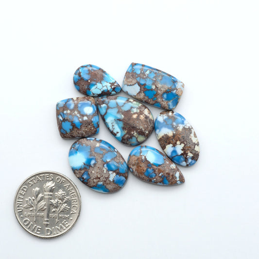 Discover the beauty of Natural Golden Hills Turquoise—prized for its icy blue tones, golden matrix, and exceptional quality. Ideal for artisan jewelry designs.

