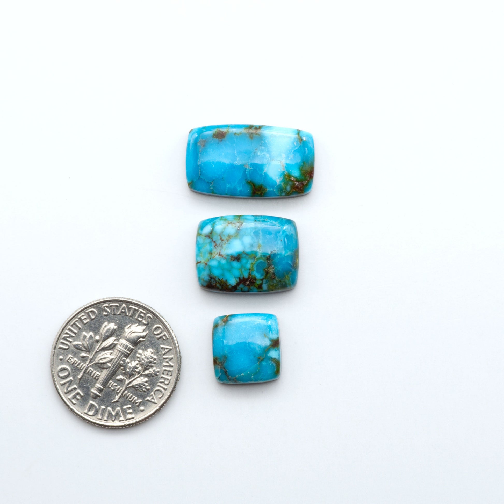 Kingman Turquoise Cabochons are a staple in the jewelry industry, known for their stunning blue-green color. Perfect for necklaces, earrings, and more!