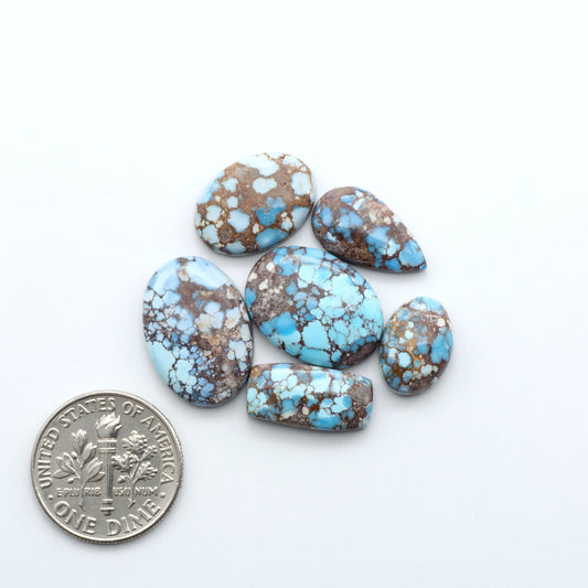 Discover the beauty of Natural Golden Hills Turquoise—prized for its icy blue tones, golden matrix, and exceptional quality. Ideal for artisan jewelry designs.