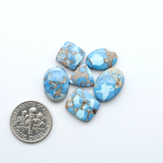 Discover the beauty of Natural Golden Hills Turquoise—prized for its icy blue tones, golden matrix, and exceptional quality. Ideal for artisan jewelry designs.
