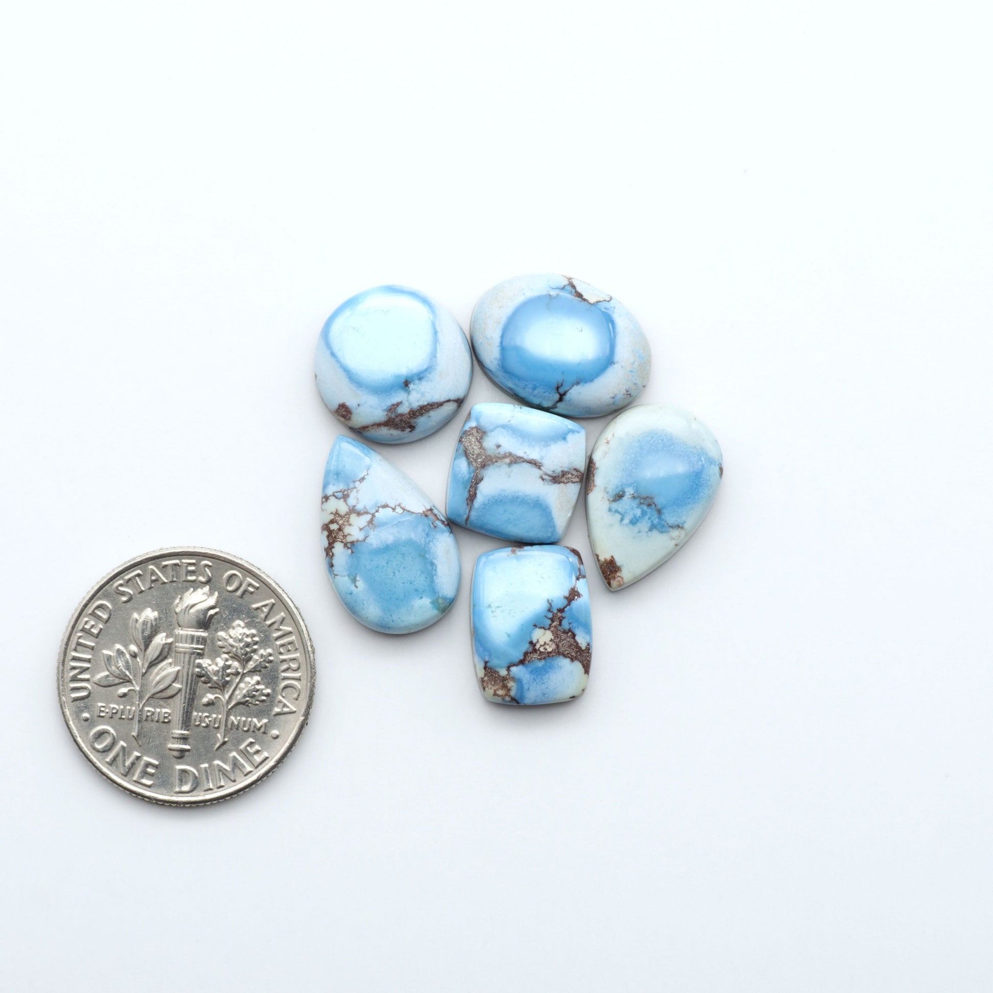 Discover the beauty of Natural Golden Hills Turquoise—prized for its icy blue tones, golden matrix, and exceptional quality. Ideal for artisan jewelry designs.