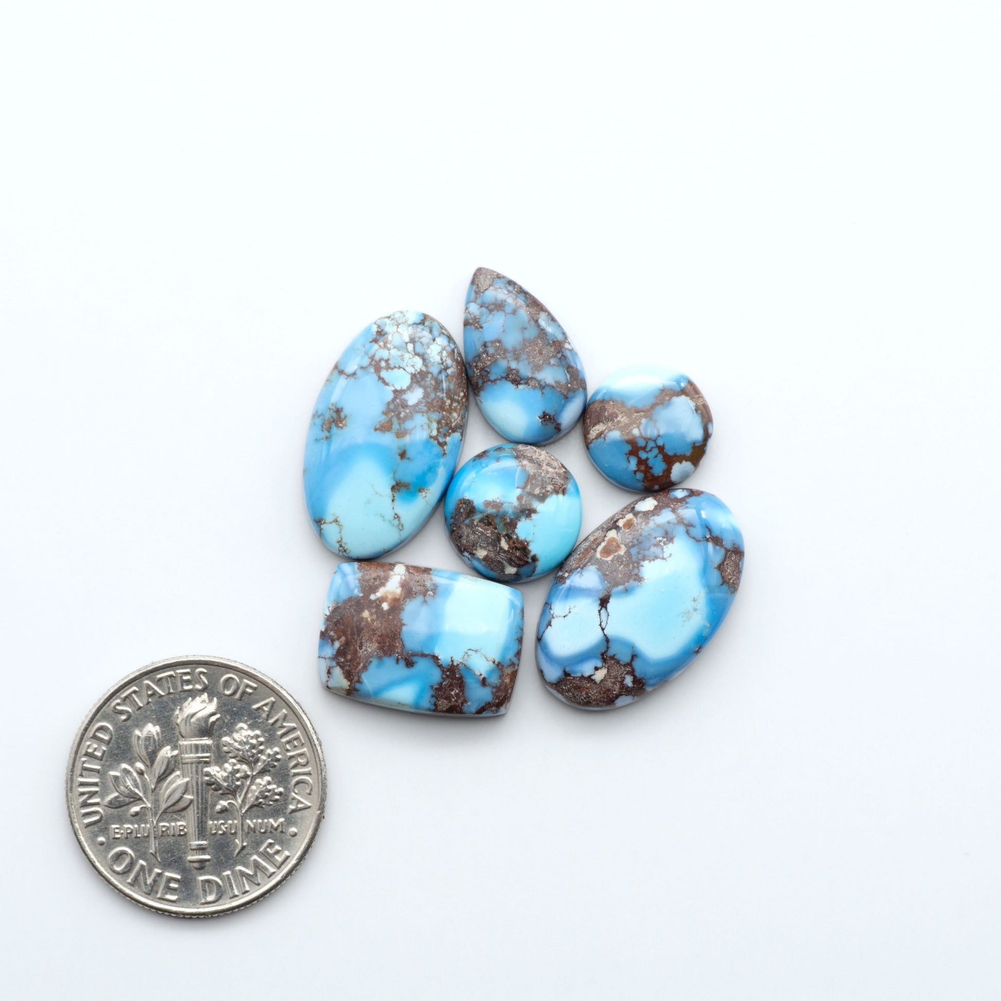 Discover the beauty of Natural Golden Hills Turquoise—prized for its icy blue tones, golden matrix, and exceptional quality. Ideal for artisan jewelry designs.