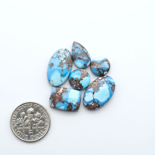 Discover the beauty of Natural Golden Hills Turquoise—prized for its icy blue tones, golden matrix, and exceptional quality. Ideal for artisan jewelry designs.
