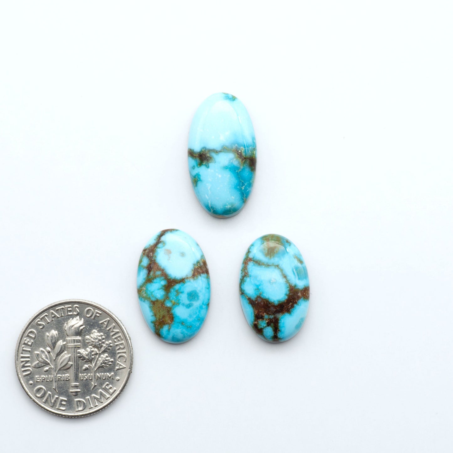 Kingman Turquoise Cabochons are a staple in the jewelry industry, known for their stunning blue-green color. Perfect for necklaces, earrings, and more!