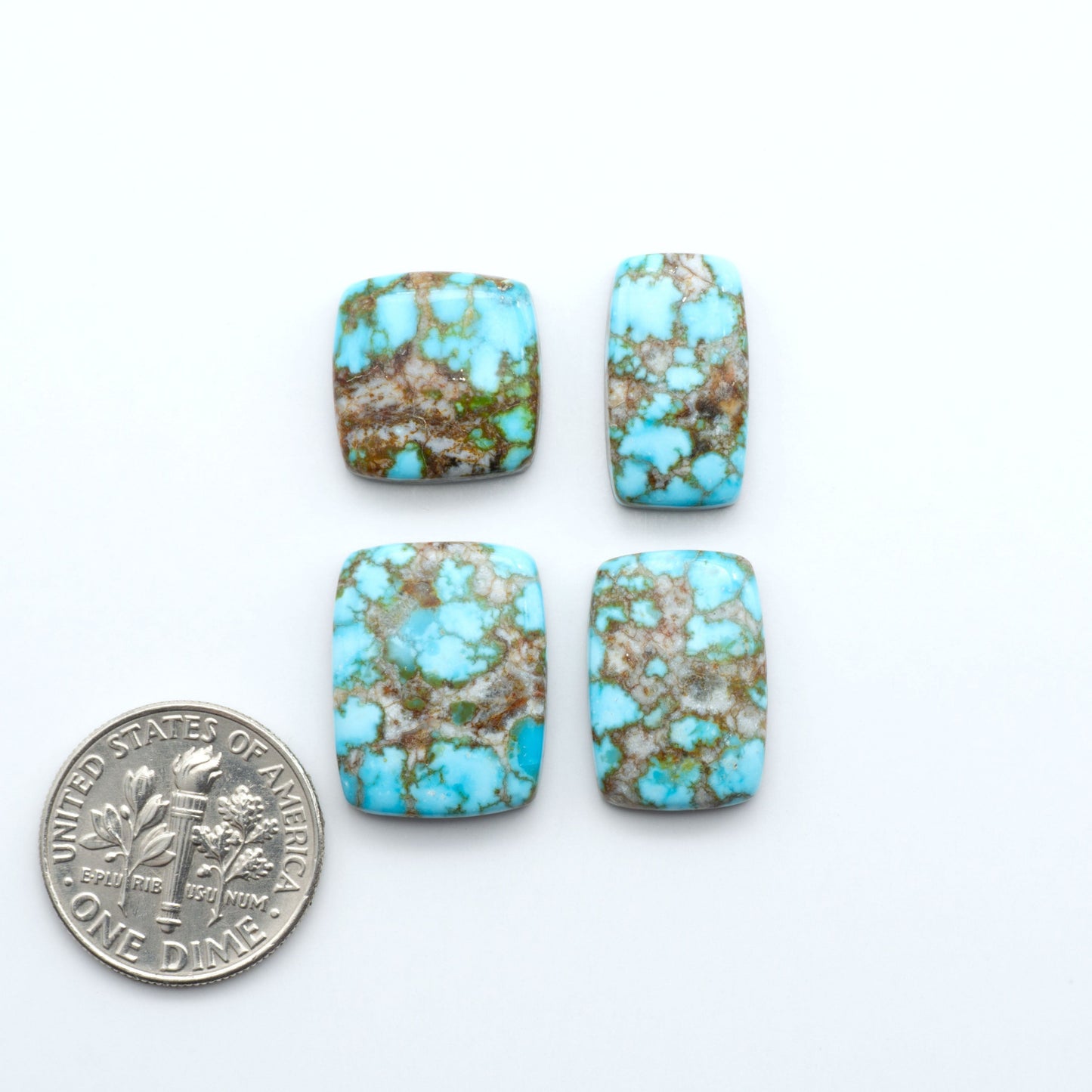 Kingman Turquoise Cabochons are a staple in the jewelry industry, known for their stunning blue-green color. Perfect for necklaces, earrings, and more!