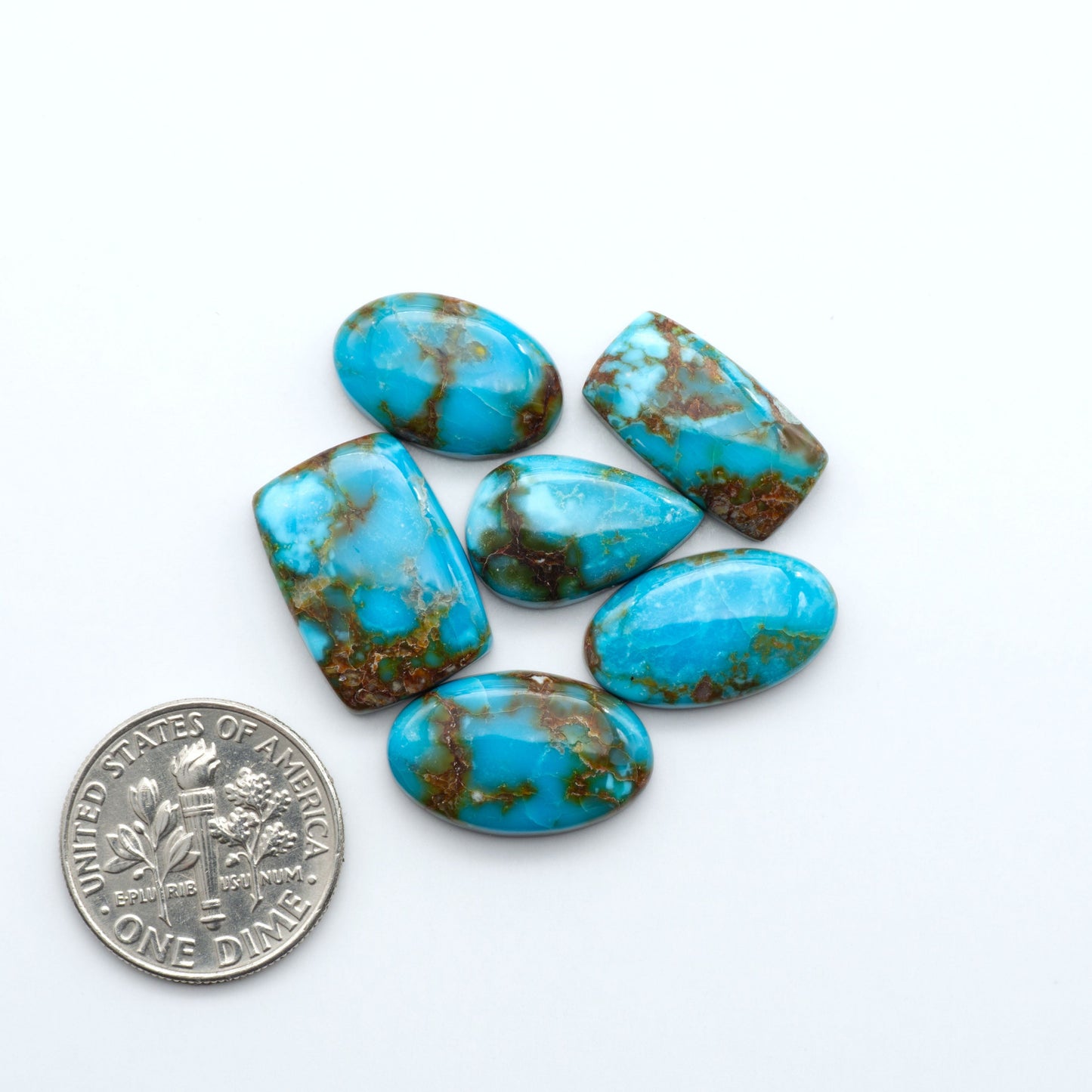 Kingman Turquoise Cabochons are a staple in the jewelry industry, known for their stunning blue-green color. Perfect for necklaces, earrings, and more!
