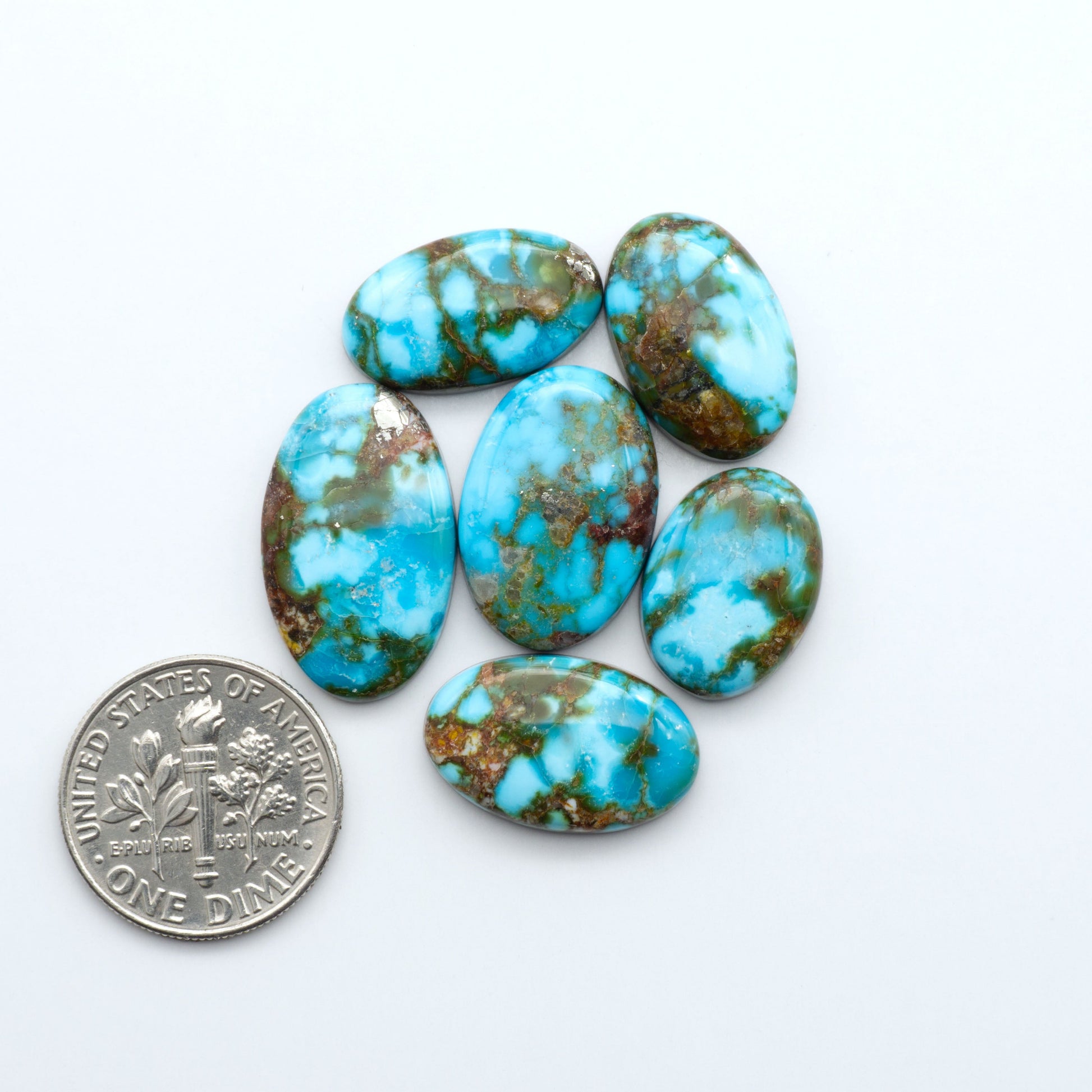 Kingman Turquoise Cabochons are a staple in the jewelry industry, known for their stunning blue-green color. Perfect for necklaces, earrings, and more!