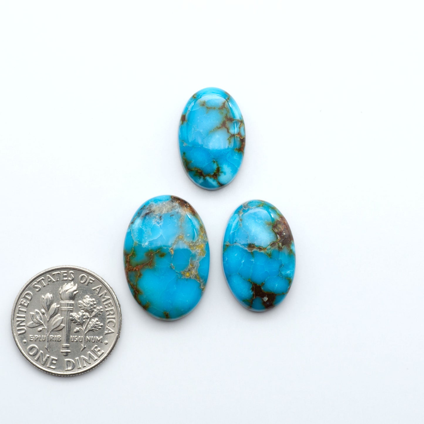 Kingman Turquoise Cabochons are a staple in the jewelry industry, known for their stunning blue-green color. Perfect for necklaces, earrings, and more!