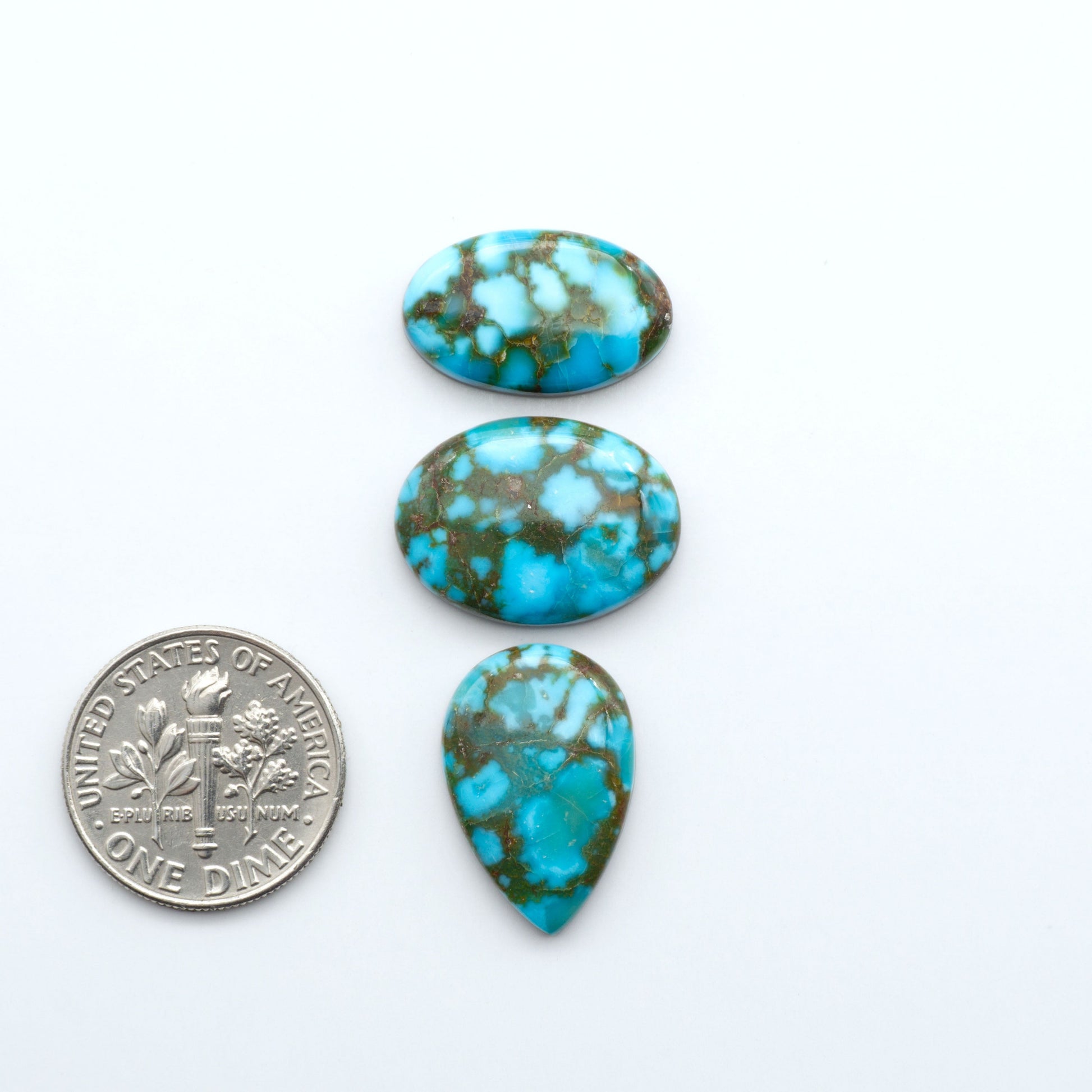 Kingman Turquoise Cabochons are a staple in the jewelry industry, known for their stunning blue-green color. Perfect for necklaces, earrings, and more!