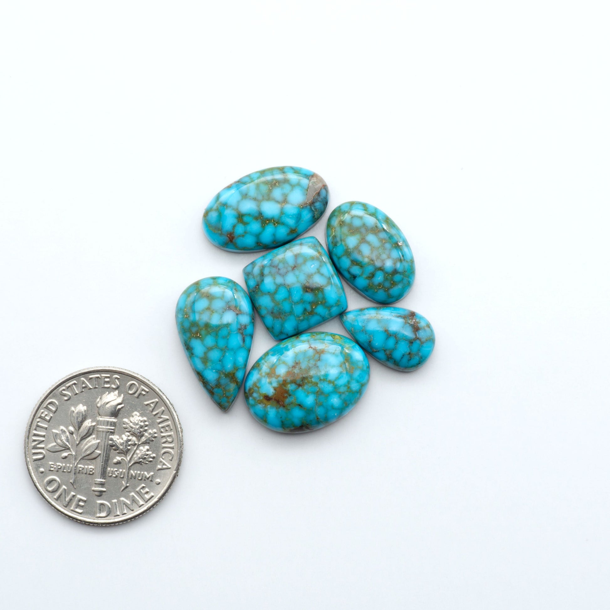 Kingman Turquoise Cabochons are a staple in the jewelry industry, known for their stunning blue-green color. Perfect for necklaces, earrings, and more!
