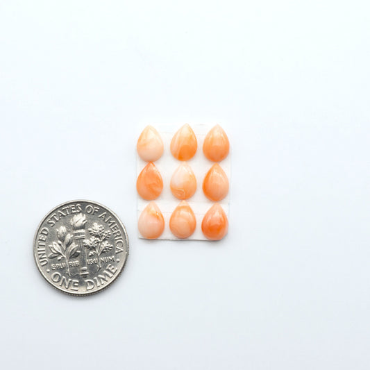 Discover natural pink Coral cabochons with soft salmon hues and smooth polish, ideal for creating timeless handcrafted rings, pendants, and custom designs.
