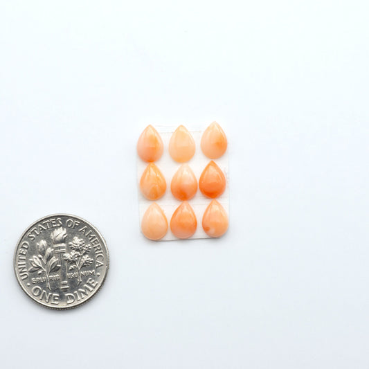 Discover natural pink Coral cabochons with soft salmon hues and smooth polish, ideal for creating timeless handcrafted rings, pendants, and custom designs.